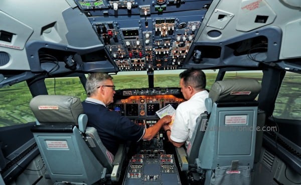Image 2 B) - training inside a full flight simulator