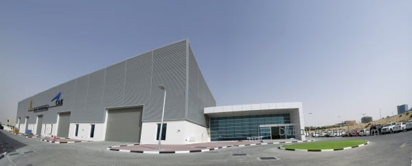 Image 3 A) - an exterior shot of the Emirates-CAE facility at DSO