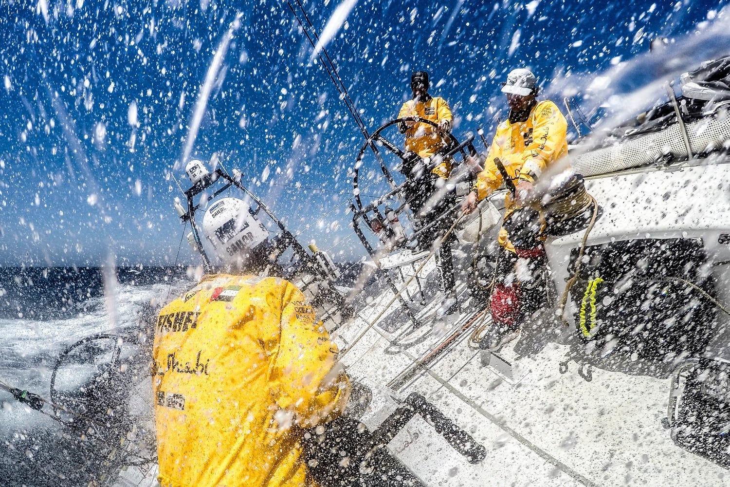 May 18, 2015. Leg 7 to Lisbon onboard Abu Dhabi Ocean Racing. Day 01. Simon "SiFi" Fisher and Roberto Bermudez 'Chuny' shrug off the spray as Daryl Wislang drives deeper into the Gulf Stream.