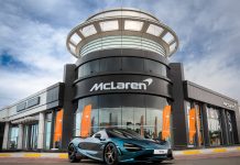 Mclaren Abu Dhabi Delivers the First 750S in UAE Representation of McLaren dealer showroom with 750S parked in front.