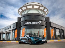 Representation of McLaren dealer showroom with 750S parked in front.